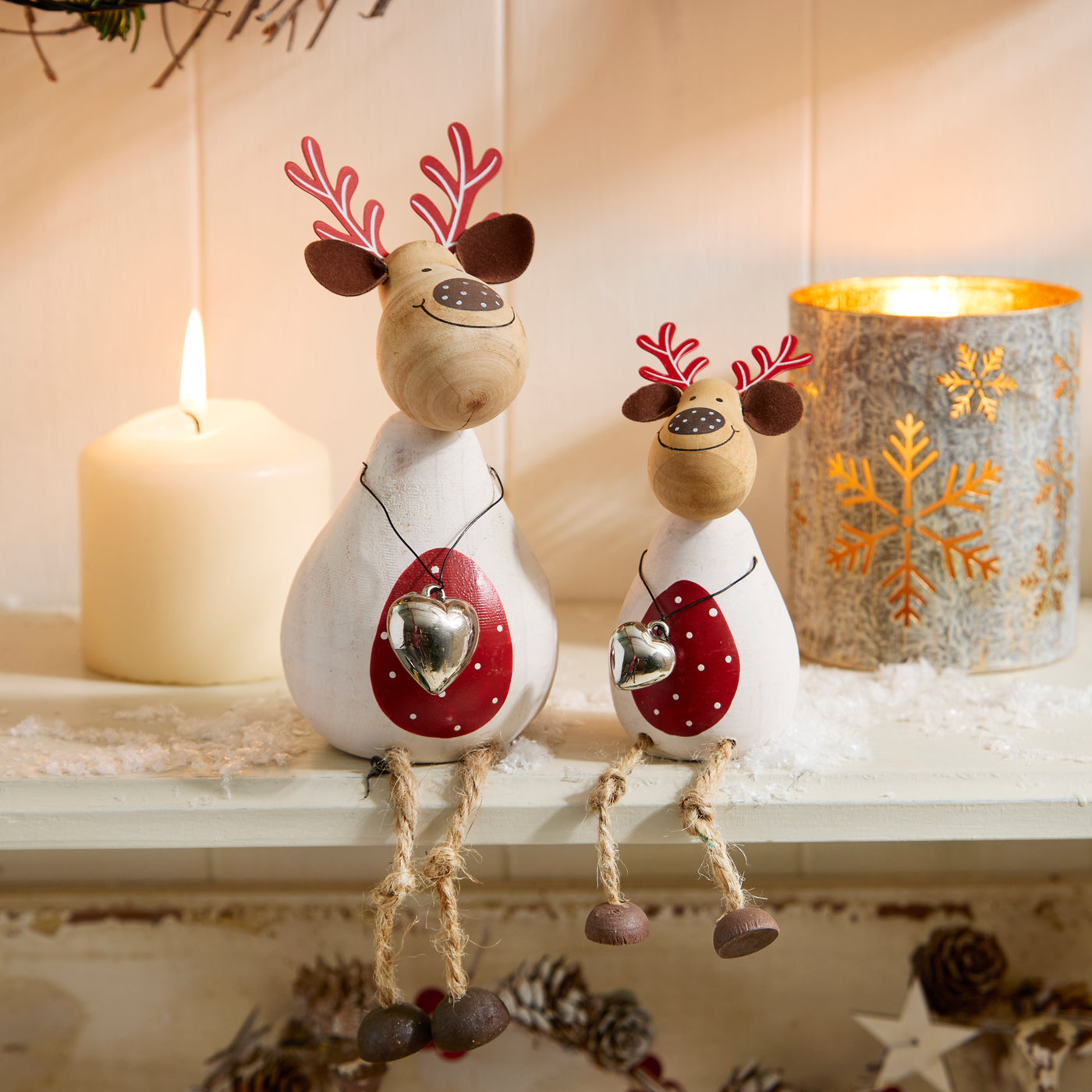 Pair of Wooden Sitting White Reindeer Figurines with Heart Decoration